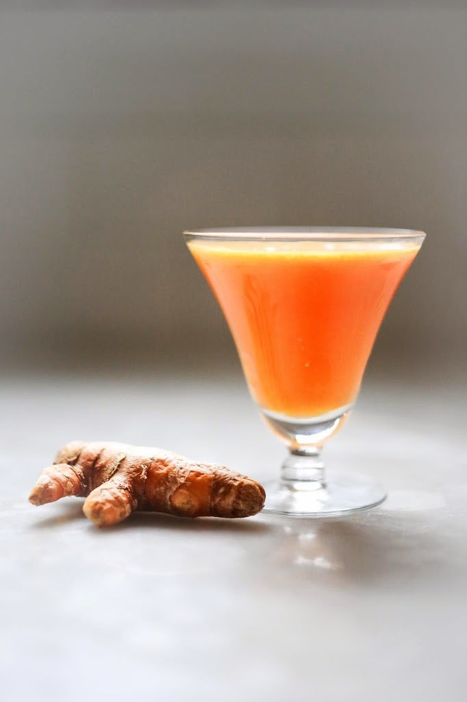 turmeric tonic Turmeric Tonic - A healthy juice made with healing turmeric root, beets, apple, ginger and carrots to help heal the body, fight inflammation, sooth and energize. | www.feastingathome.com