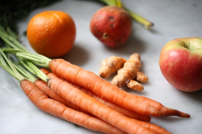 Turmeric Tonic | A fresh healthy juice made with fresh turmeric root, beets, apple and carrots to help detox and revitalize you! | www.feastingathome.com