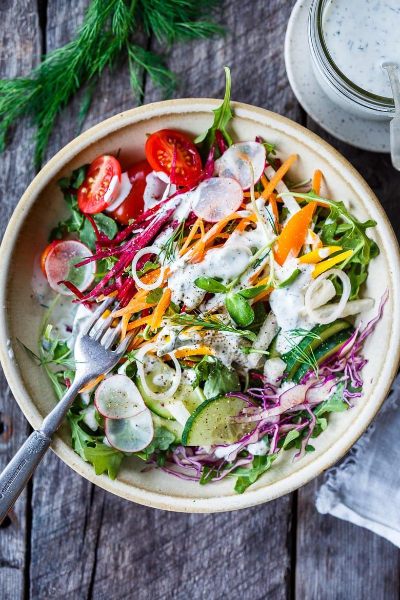 This beautiful Rainbow Salad is full of healthy seasonal veggies and can be made ahead and brought to potlucks and gatherings. Vegan adaptable!  Serve it with Herby hemp Dressing or Dilly Ranch Dressing. Vegan Adaptable!