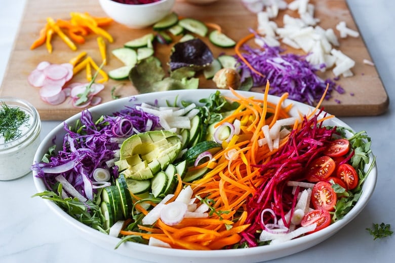 assembling rainbow salad 