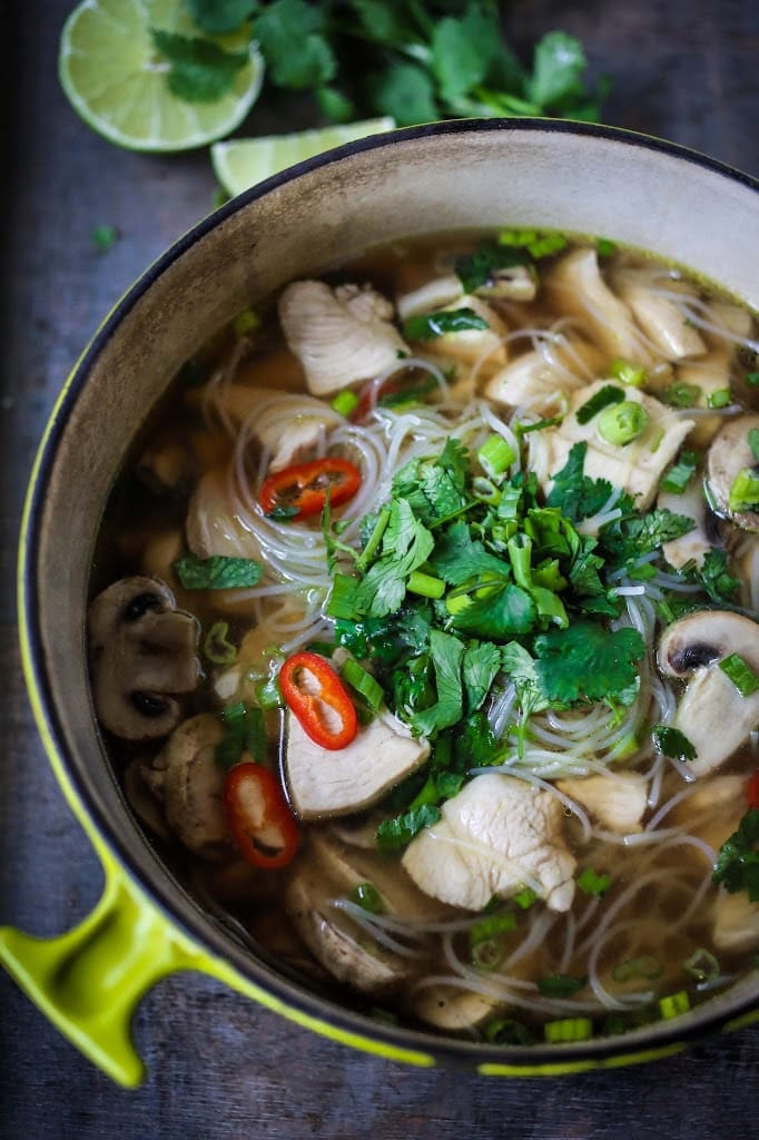 A steaming bowl of Thai Chicken Noodle Soup infused with lemongrass and ginger.  A healthy, low fat, gluten-free meal, full of amazing Thai flavors! 