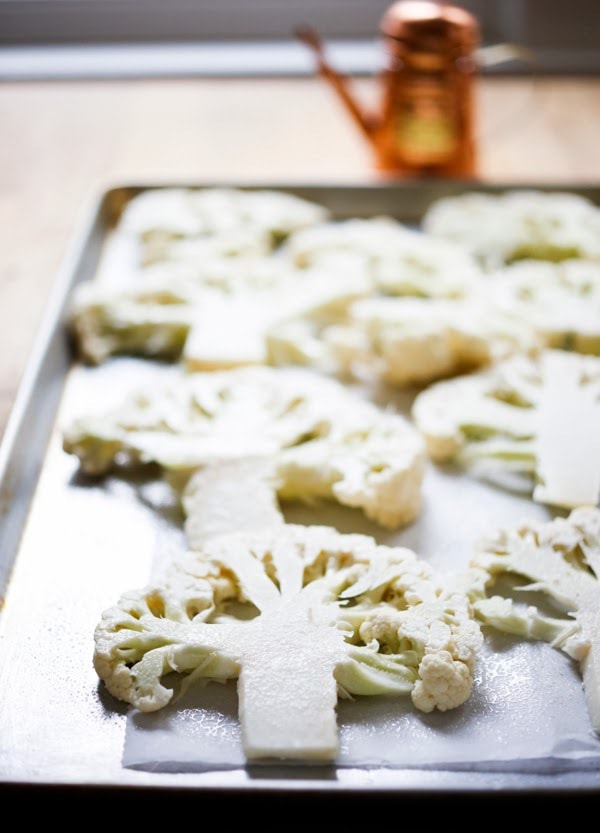 Roasted Cauliflower Steaks with Lemon Herb Gremolada, a healthy delicious side dish you will love! | www.feastingathome.com