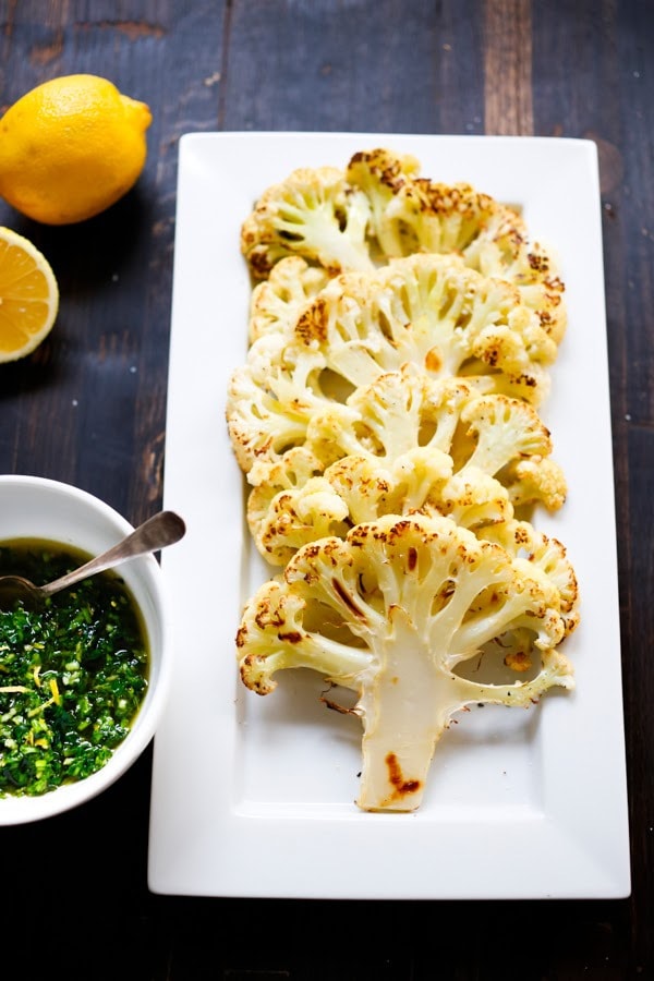 Roasted Cauliflower Steaks with Lemon Herb Gremolada, a healthy delicious side dish you will love! | www.feastingathome.com