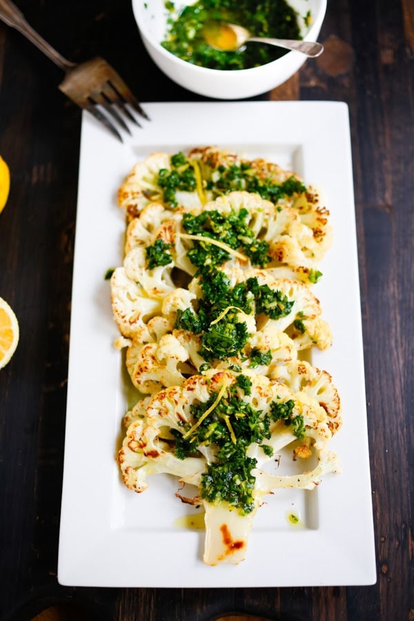 Roasted Cauliflower Steaks with Lemon Herb Gremolada, a healthy delicious side dish you will love! | www.feastingathome.com