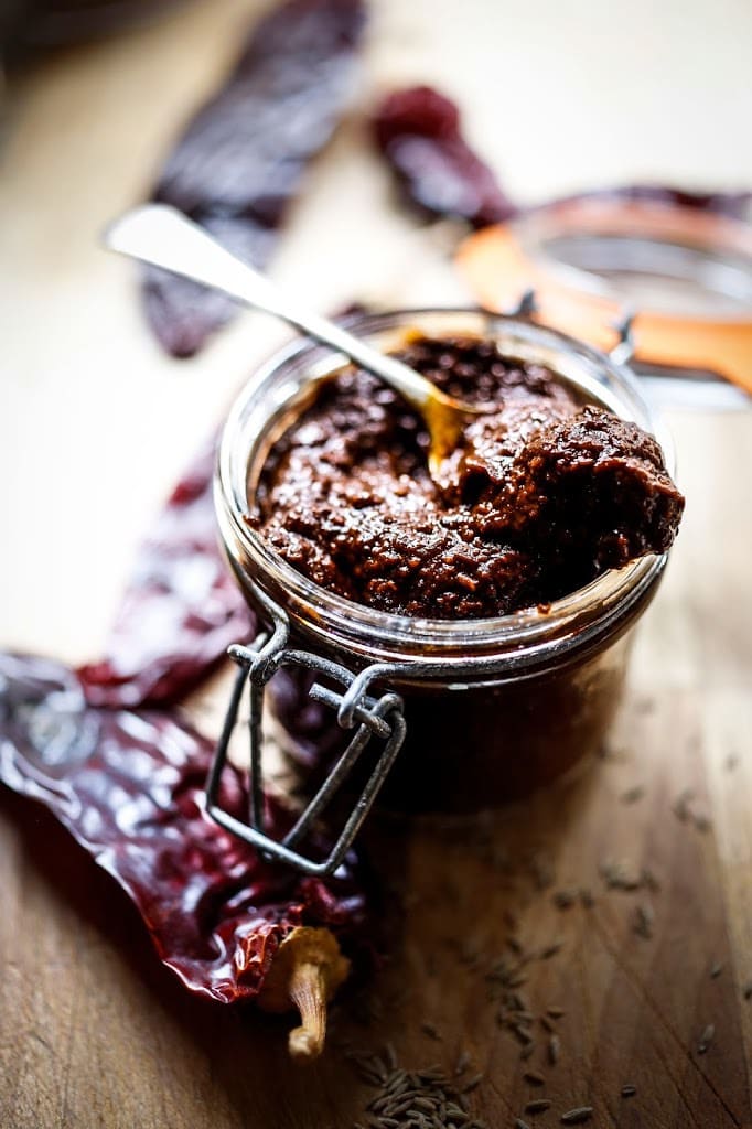 Authentic Harissa Paste Recipe- a north African condiment that will add depth and smokey spice to meats, stews and roasted vegetable dishes. | www.feastingathome.com