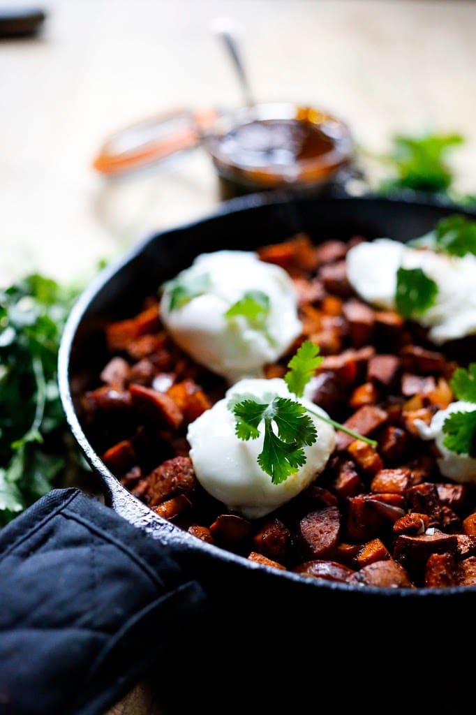 Sweet Potato Hash with Poached Eggs and Harissa Paste - a delicious, North-African inspired, one-skillet breakfast that is bursting with flavor! Gluten Free #sweetpotato #sweetpotatohash #harissa #harissapaste #harissasauce #eggs #morocan