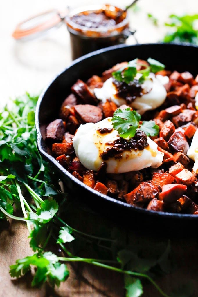 Sweet Potato Hash with Poached Eggs and Harissa Paste - a delicious, North-African inspired, one-skillet breakfast that is bursting with flavor!   Gluten Free #sweetpotato #sweetpotatohash #harissa #harissapaste #harissasauce #eggs #morocan 