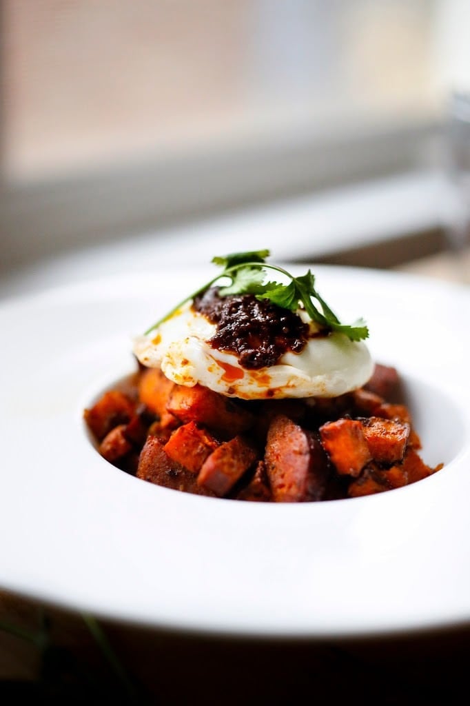 Sweet Potato Hash with Poached Eggs and Harissa Paste - a delicious, North-African inspired, one-skillet breakfast that is bursting with flavor! Gluten Free #sweetpotato #sweetpotatohash #harissa #harissapaste #harissasauce #eggs #morocan