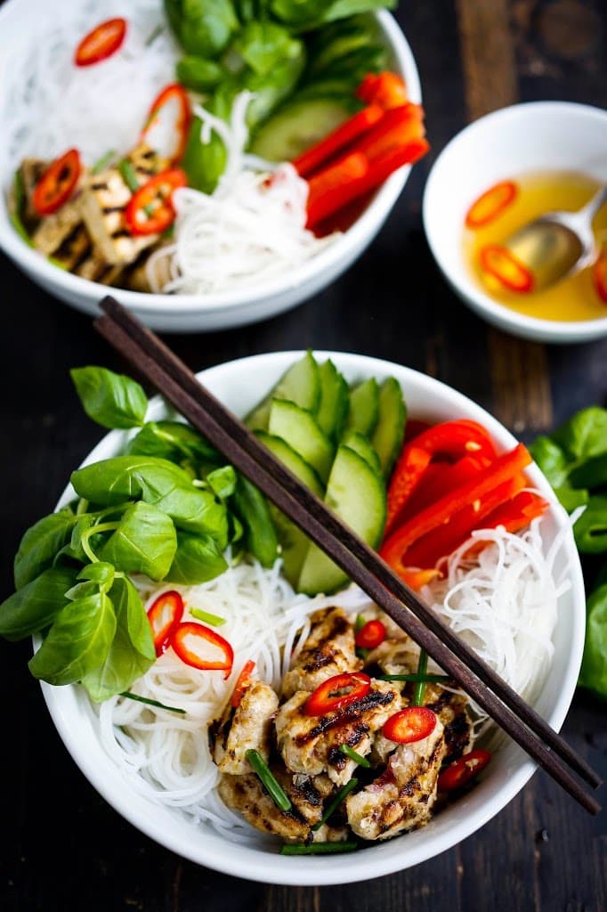 Flavorful Vietnamese Vermicelli w/ lemongrass chicken (or tofu) served over rice vermicelli noodles, w/ veggies and basil & flavorful Vietnamese dressing (Nuoc Cham) . Delicious!! | www.feastingathome.com