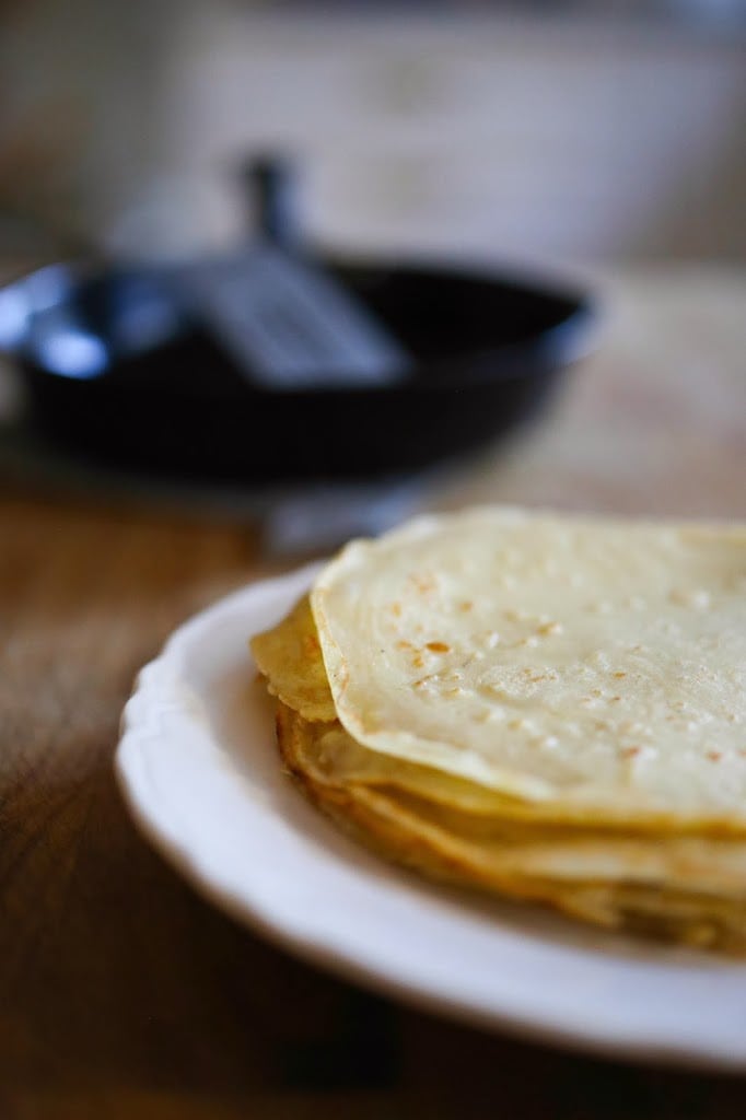 Savory Mushroom Crepes with Spaghetti Squash and Sage drizzled with Bechemal Sauce - a hearty cozy vegetarian dinner recipe, perfect for the colder months! #crepes #savorycrepes #mushroomcrepes #mushroomcrepes www.feastingathome.com