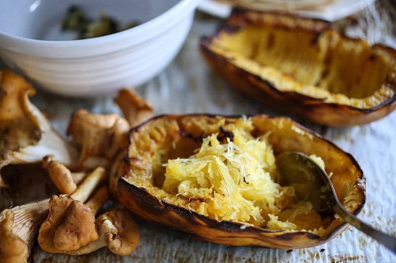 Savory Mushroom Crepes with Spaghetti Squash and Sage drizzled with Bechemal Sauce - a hearty cozy vegetarian dinner recipe, perfect for the colder months! #crepes #savorycrepes #mushroomcrepes #mushroomcrepes www.feastingathome.com