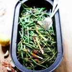 Charred Green beans with Bagna Cauda- an Italian sauce made with olive oil, minced anchovies, garlic, pepper and chili flakes- a flavorful side dish with lovely umami flavor.