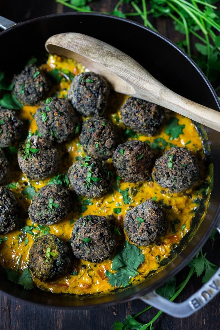 Vegan Lentil Meatballs with Indian Coconut Curry Sauce- a delicious healthy meal infused with fragrant Indian spices. Vegan and Gluten Free! #veganmeatballs #lentilmeatballs #vegan #indianmeatballs #veg