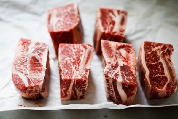 beef short ribs on a piece of parchment.