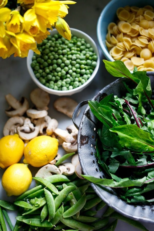 Spring Pasta Carbonara with Fresh Peas, Asparagus and Burrata with Orchetti - aka, "little ear" pasta) in a light carbonara sauce. | www.featstingathome.com 