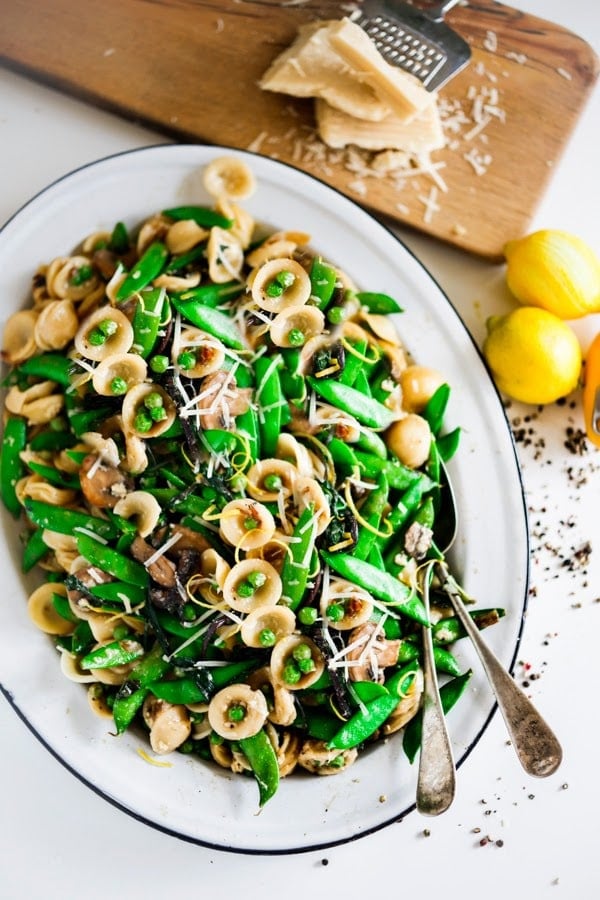 Spring Orecchiette Pasta with asparagus, mushrooms, peas and fresh herbs in a light carbonara sauce with dollops of creamy Burrata cheese. | #orecchiette #burrata #springpasta