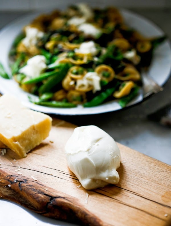 Spring Pasta Carbonara with Fresh Peas, Asparagus and Burrata with Orchetti - aka, "little ear" pasta) in a light carbonara sauce. | www.featstingathome.com 