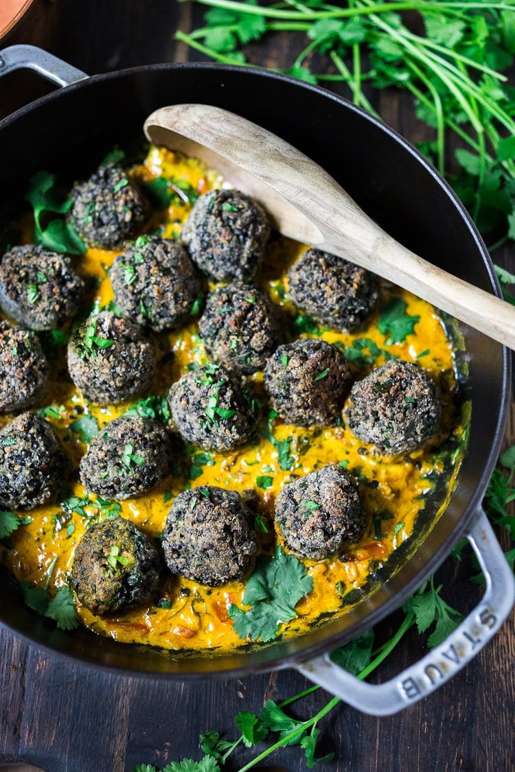 Vegan Lentil Meatballs with Coconut Curry Sauce- a delicious healthy meal infused with fragrant Indian spices. Meatballs are always a potluck hit, these will make your veggie friends very happy!  Vegan and Gluten Free!  