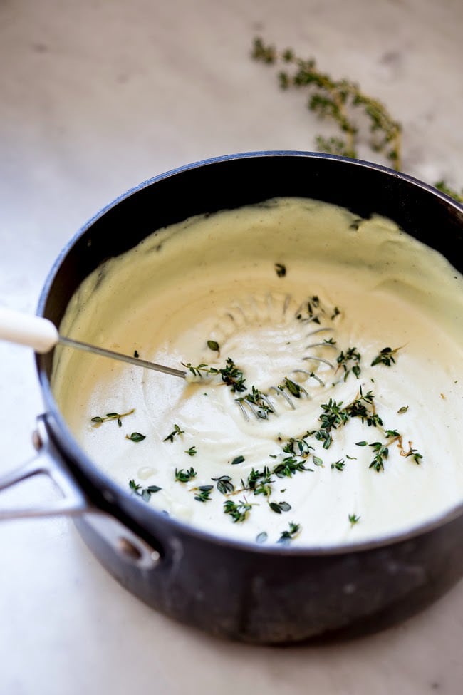 Artichoke Souffle with Goat Cheese and thyme- make with fresh artichoke hearts- a decadent and delicious appetizer. | www.feastingathome.com #artichoke #artichokes #appetizer #souffle