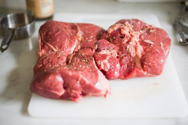 Herb-Crusted, Stuffed Leg of Lamb with flavorful Mint Gremolata, a step by step guide to an amazingly delicious holiday main course, baked over roasted vegetables. #legoflamb #lamb #lambleg #easterdinner #easter #stuffedlamb #lambrecipes