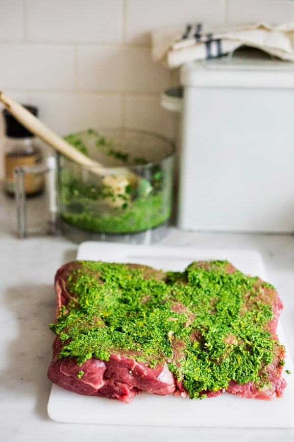 Herb-Crusted, Stuffed Leg of Lamb with flavorful Mint Gremolata, a step by step guide to an amazingly delicious holiday main course, baked over roasted vegetables.  #legoflamb #lamb #lambleg #easterdinner #easter #stuffedlamb #lambrecipes 