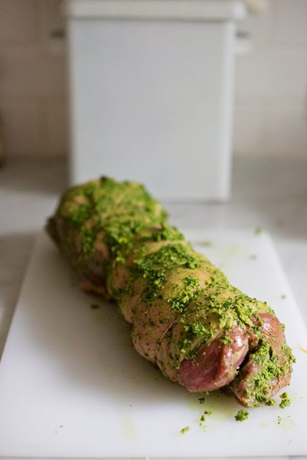 Herb-Crusted, Stuffed Leg of Lamb with flavorful Mint Gremolata, a step by step guide to an amazingly delicious holiday main course, baked over roasted vegetables.  #legoflamb #lamb #lambleg #easterdinner #easter #stuffedlamb #lambrecipes 
