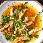 Feel Better Chicken Soup with Lemon and Ginger will warm you to your bones! Brothy and flavorful, this highly-adaptable recipe is the perfect base for your own creations- use whatever grain or starch you prefer- noodles, rice quinoa, beans- or keep it keto and low-carb! Can also be made in an Instant Pot or Slow cooker! #chickensoup #ketosoup #broth