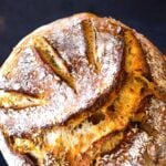 An EASY recipe for No-Knead Sourdough Bread that rises overnight and is baked in the morning. #sourdough #yeastless