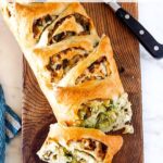 A simple delicious recipe for Crusty Cheesy Leek Bread to serve with your favorite soups and stews. #leeks #bread