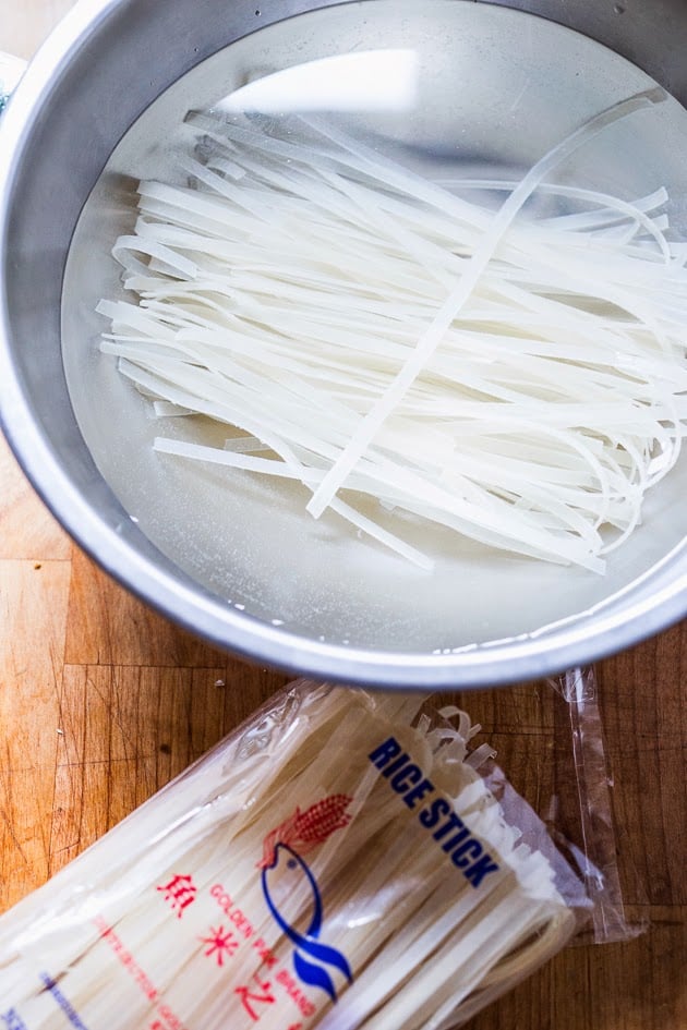 rice noodles soaking in a bowl.