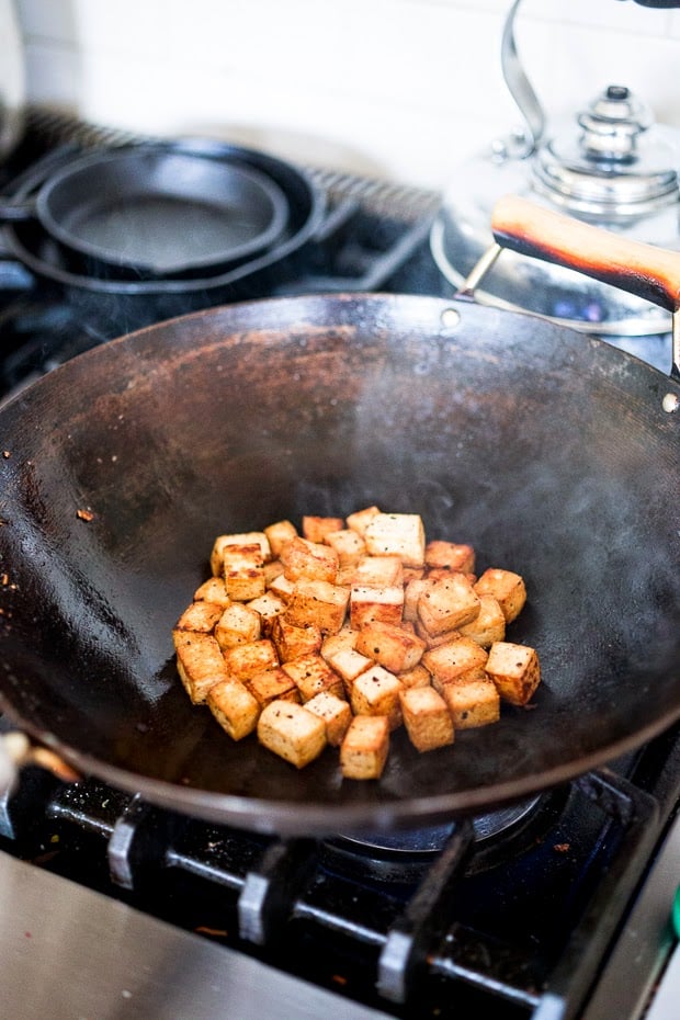 Crispy Vegan Tofu stir-fried in the most flavorful Black Garlic Sauce ....a delicious way to prepare tofu! | www.feastingathome.com #blackgarlic #tofu #crispytofu #tofustirfry #vegantofu #stirfrytofu 