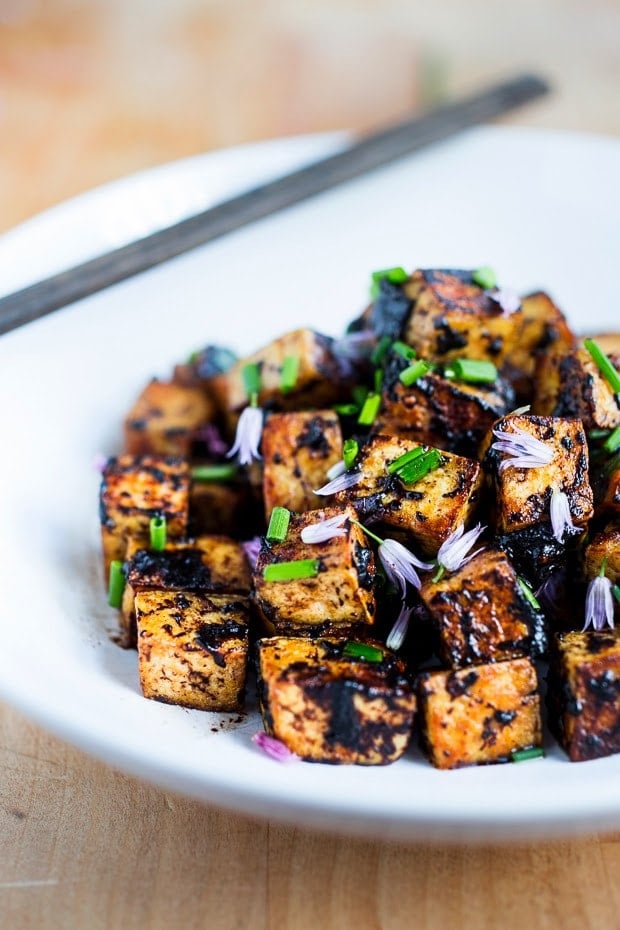 Crispy Vegan Tofu stir-fried in the most flavorful Black Garlic Sauce ....a delicious way to prepare tofu! | www.feastingathome.com #blackgarlic #tofu #crispytofu #tofustirfry 