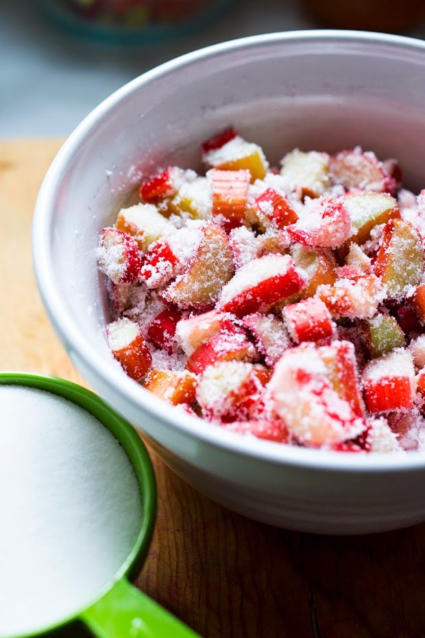 A simple delicious recipe for Rhubarb Shrub that can be used to make cocktails and mocktails. A great way to preserve the rhubarb growing in your garden! #shrub #rhubarb #rhubarbrecipes #mocktail | Feasting at Home