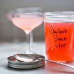 A simple delicious recipe for Rhubarb Shrub that can be used to make cocktails and mocktails. A great way to preserve the rhubarb growing in your garden! #shrub #rhubarb #rhubarbrecipes #mocktail | Feasting at Home
