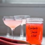 A simple delicious recipe for Rhubarb Shrub that can be used to make cocktails and mocktails. A great way to preserve the rhubarb growing in your garden! #shrub #rhubarb #rhubarbrecipes #mocktail | Feasting at Home