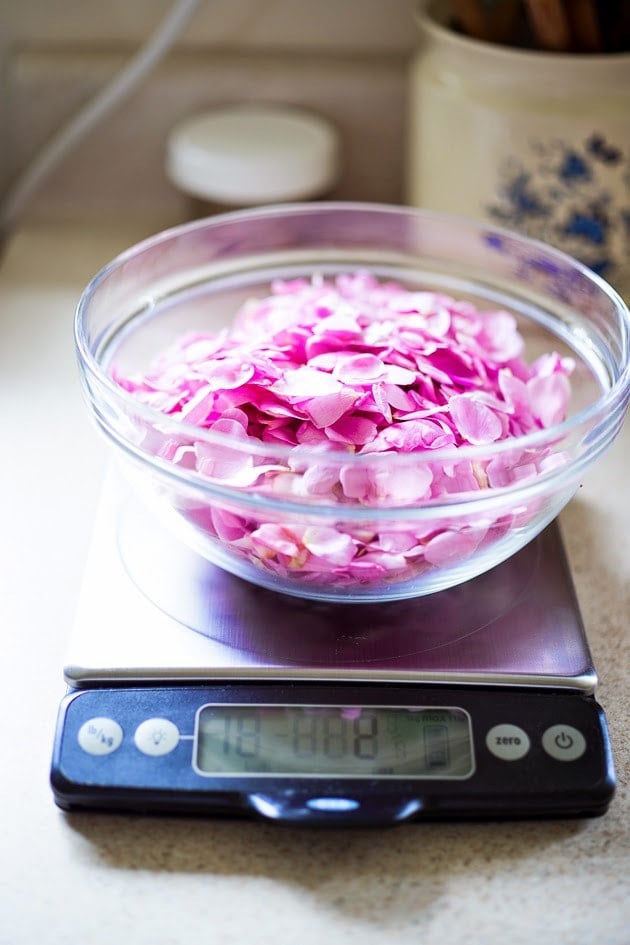 Homemade Rose Petal Jam- a simple delicious recipe made with wild rose petals, perfect on toast, scones or crepes, or spooned over ice-cream or cake. #rosepetaljam #rose #rosejam #roserecipes