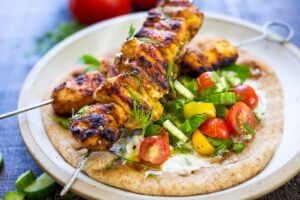 This EASY Grilled Chicken Shawarma recipe is bursting with Middle Eastern Flavors! Serve it as a wrap, in pita bread with tzatziki sauce and Israeli Salad. | #shawarma #chicken #chickenshawarma #shawarmawrap