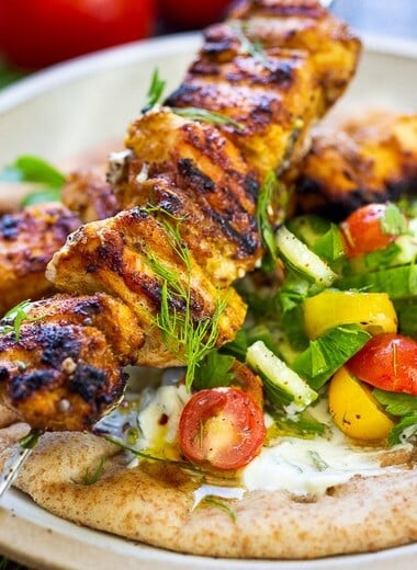 This EASY Grilled Chicken Shawarma recipe is bursting with Middle Eastern Flavors! Serve it as a wrap, in pita bread with tzatziki sauce and Israeli Salad. | #shawarma #chicken #chickenshawarma #shawarmawrap