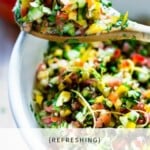 Simple healthy Israeli Salad, made with finely chopped vegetables, fresh herbs, lemon and olive oil. Vegan and Gluten Free! | www.feastingathome.com #israelisalad #vegan #vegansalad #veggies #lunch #middleeastern #healthysalad