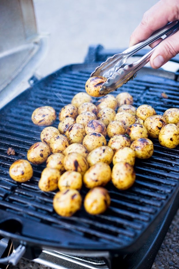 Grilled potato salad with a black garlic vinaigrette...a flavorful, lightened-up potato salad to serve alongside grilled meat or fish! Serve this warm or chilled.  #grilled #potatosalad #blackgarlic #healthypotatosalad #vegan