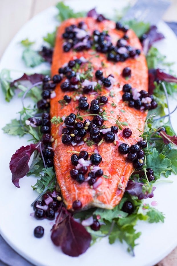 Pickled Huckleberries make this Grilled Huckleberry Salmon recipe a winner. Served atop Grilled salmon, this is a true Northwest inspired summer meal. Gluten free, healthy! | www.feastingathome.com