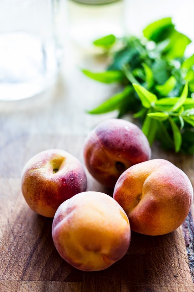 Simple Refreshing Peach Sangria ...a delicious summer drink made with white wine and Elder flower liquor (or syrup) that can be made ahead. Perfect for a crowd!  #peachsangria #peach #sangria | www.feastingathome.com