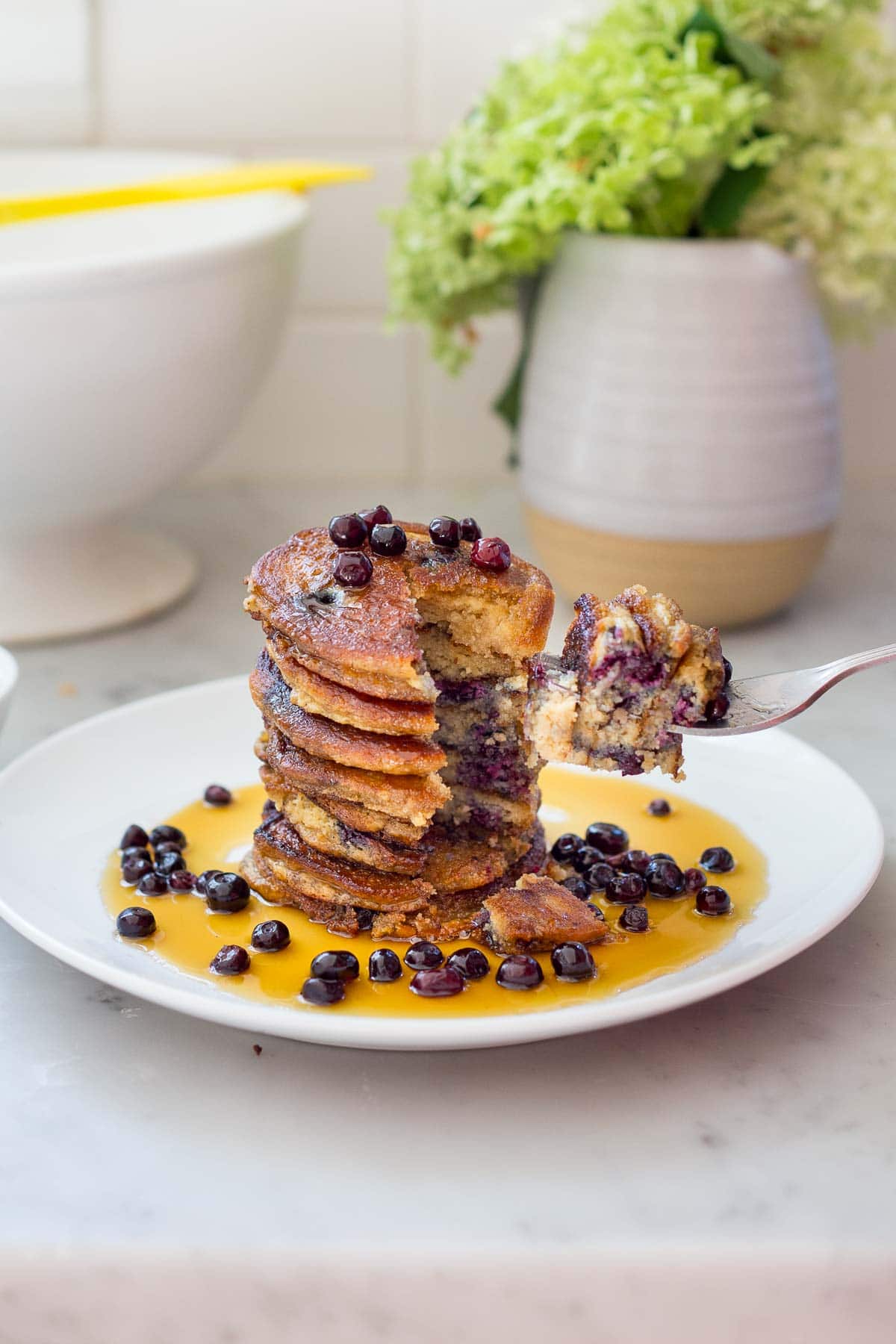 Almond Flour Pancakes with maple syrup and fresh berries- a delicious, one bowl, grain-free, gluten-free, paleo recipe for our favorite breakfast!