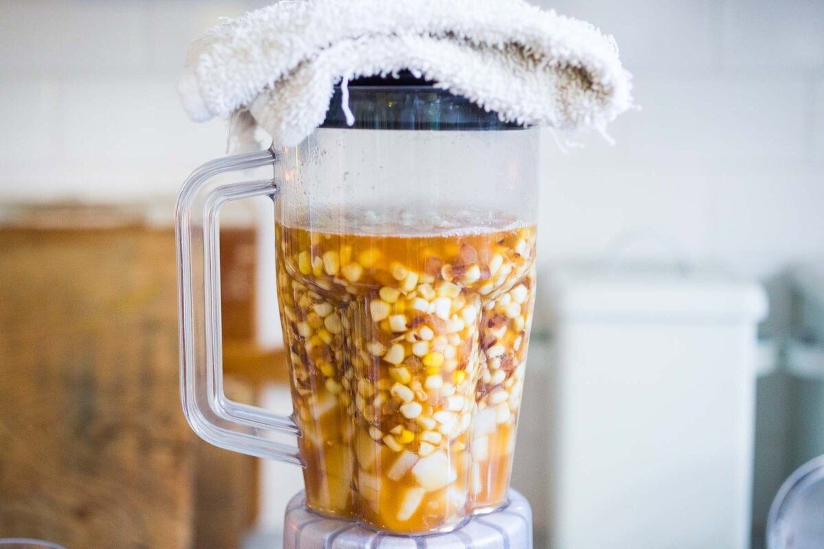 corn soup in a blender on the counter.