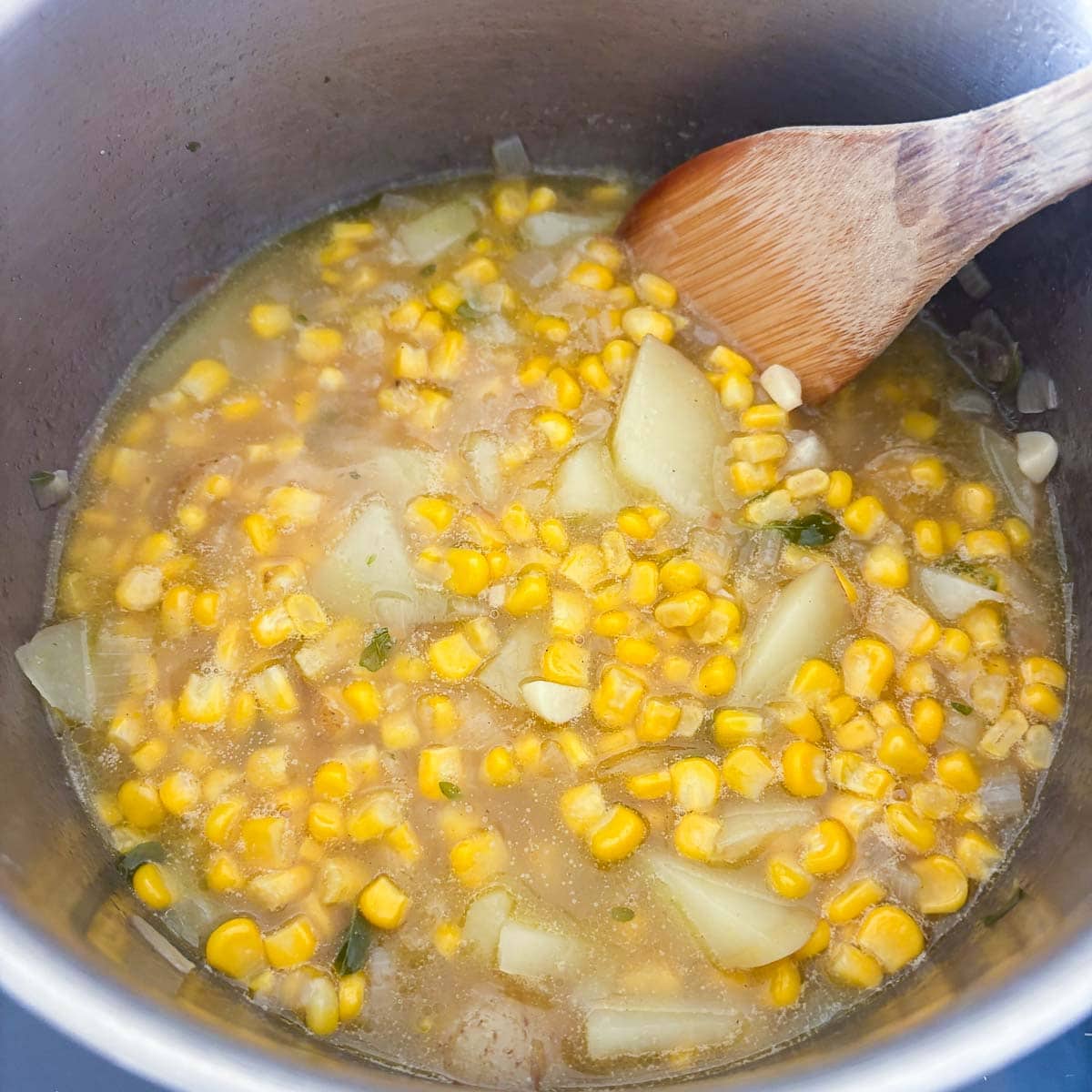 simmering corn soup in a pot. 