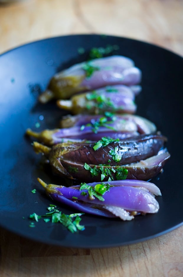 Moroccan pickled eggplant with garlic, coriander and cilantro. Drizzled with olive oil they make the perfect addition to any meal. | www.feastingathome.com.com