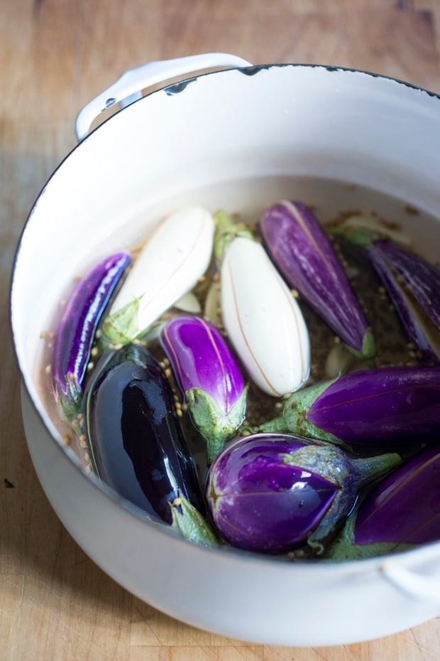 Moroccan pickled eggplant with garlic, coriander and cilantro. Drizzled with olive oil they make the perfect addition to any meal. | www.feastingathome.com.com