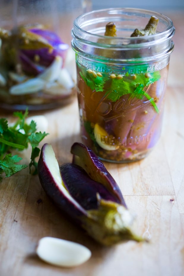 Moroccan pickled eggplant with garlic, coriander and cilantro. Drizzled with olive oil they make the perfect addition to any meal. | www.feastingathome.com.com