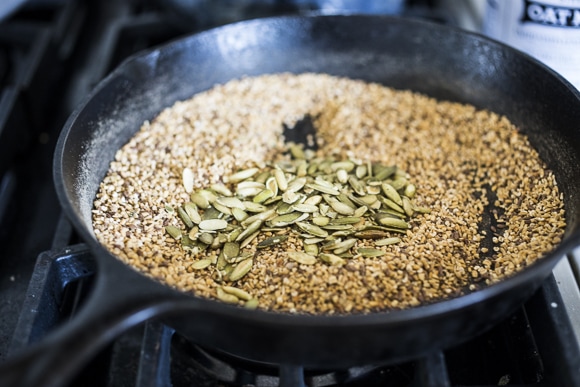 adding pumpkin seeds and spices