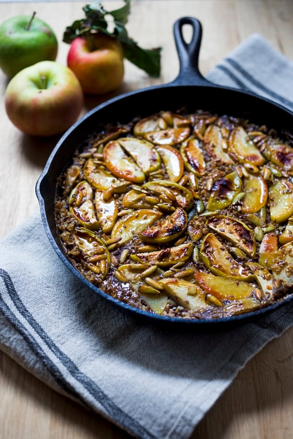 A simple delicious recipe for Baked Steal-Cut Oats with apples, flax seeds, sesame seeds,  pumpkin seeds, warming spices and maple syrup. Vegan and GF-adaptable! just 15 minutes of hands-on time before baking in the oven!